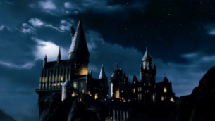 Window lights that outline the night beauty of the Hogwarts castle.